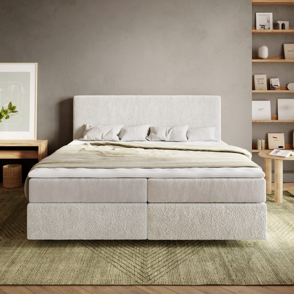 Postel Boxspring Dream-Well bouclé krémovo-bílá 180×200 cm s pružinovou matrací a visco topperem